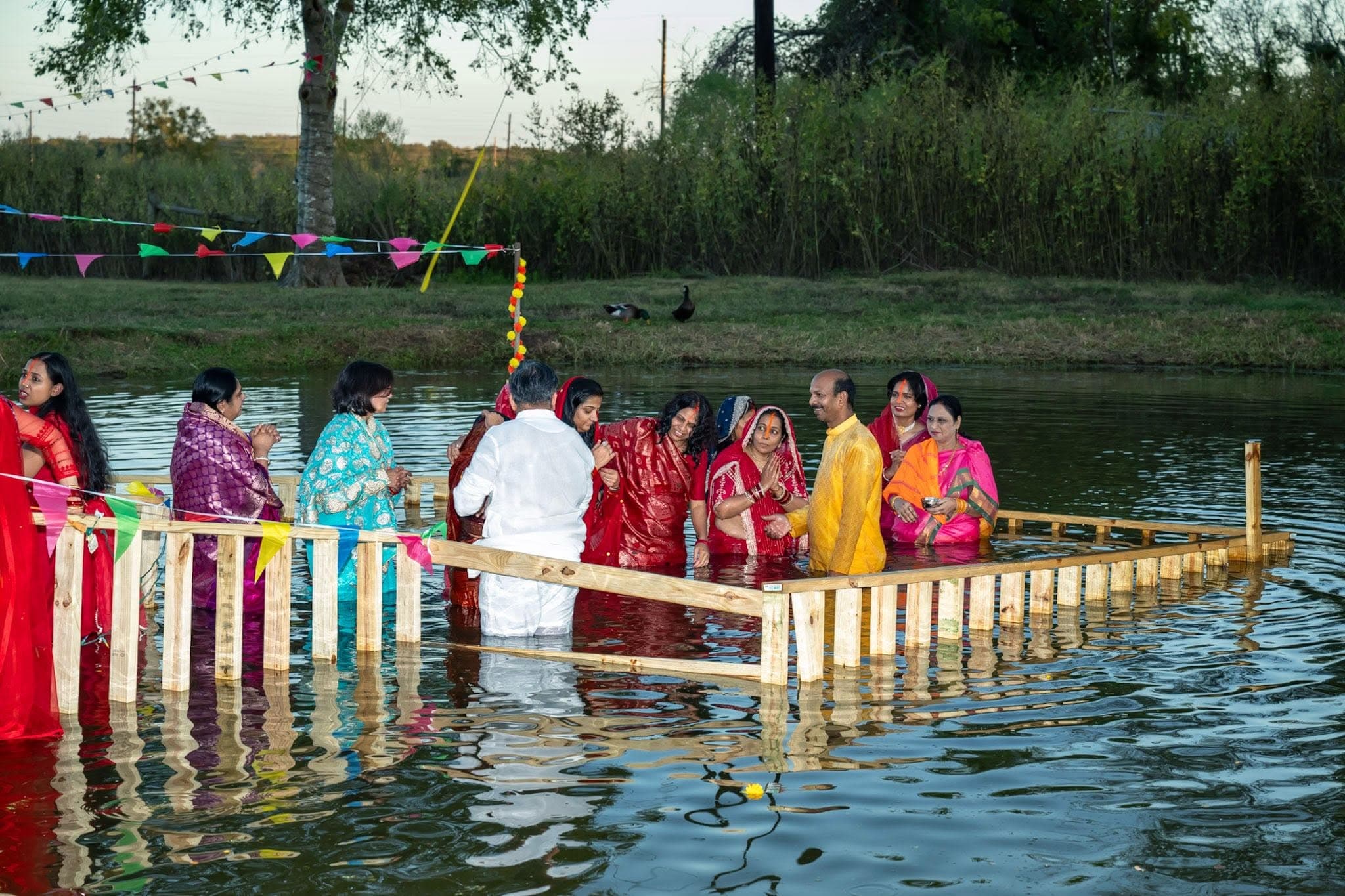 Chhath Houston volunteers and families at the festival